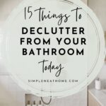 Pinterest pin for 15 Things to Declutter from your Bathroom today by Simple Neat Home