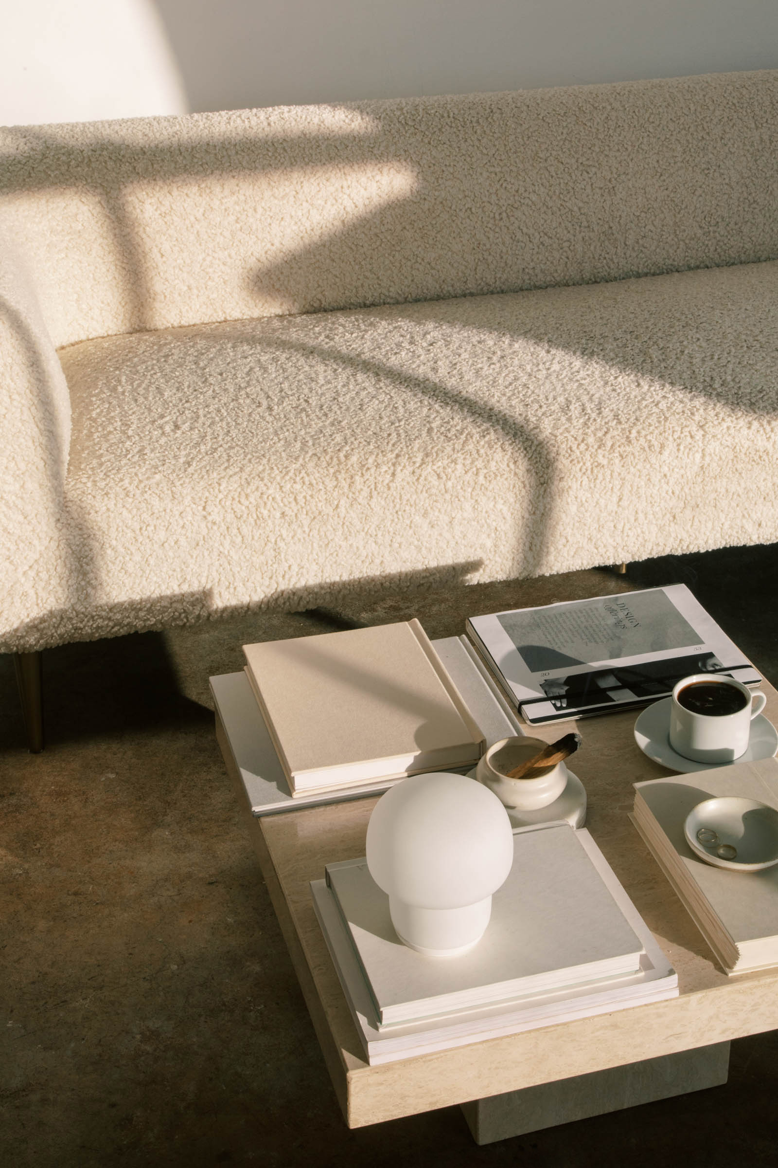 A boucle sofa with perfectly styled coffee table