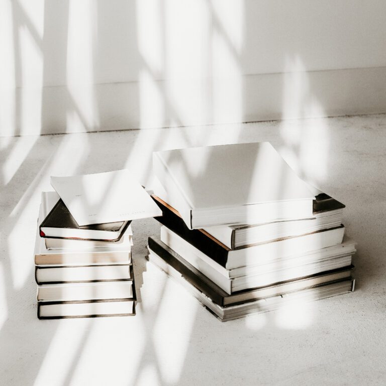 A pile of books in a patch of sunshine